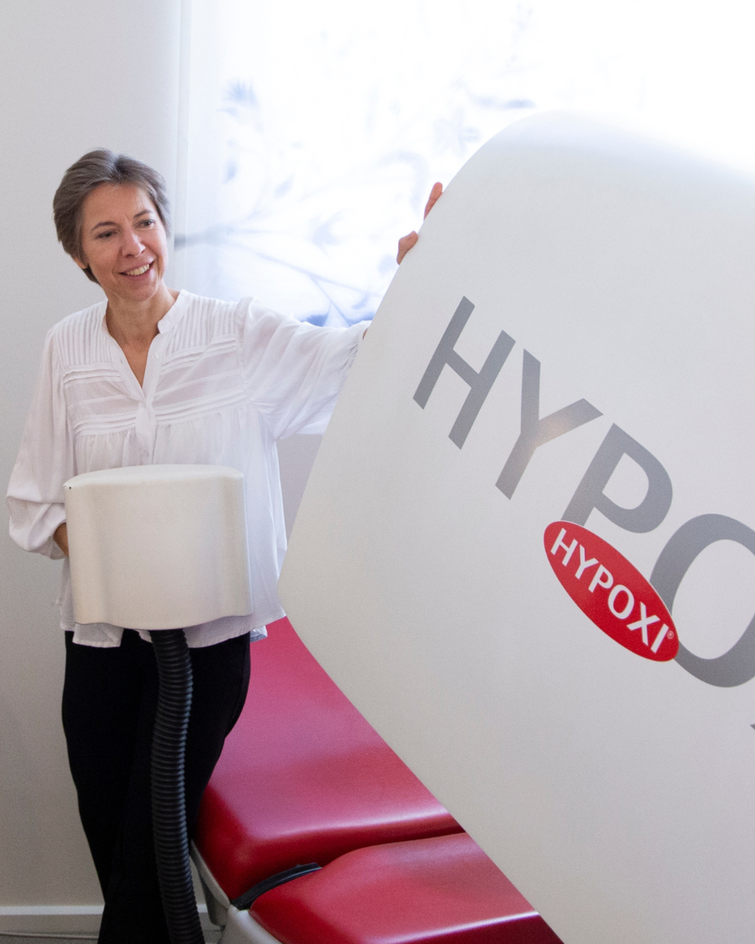 Klant op de Hypoxi vacufiets bij Body Wave